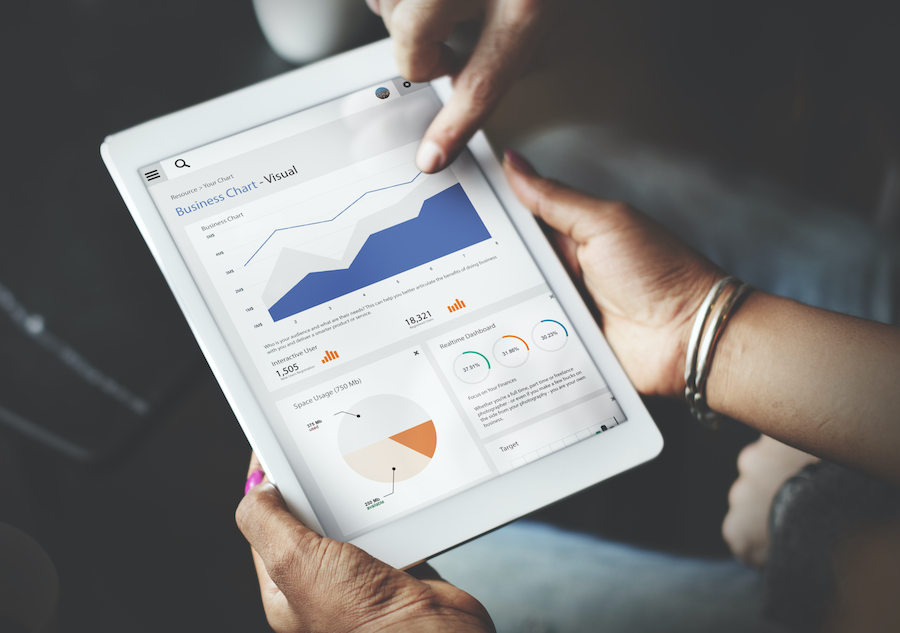 Hands Using Tablet Screen Showing Statistics Business Data